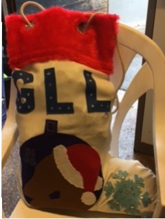 A stocking made by a family who filled in with lots of goodies for the greyhounds.